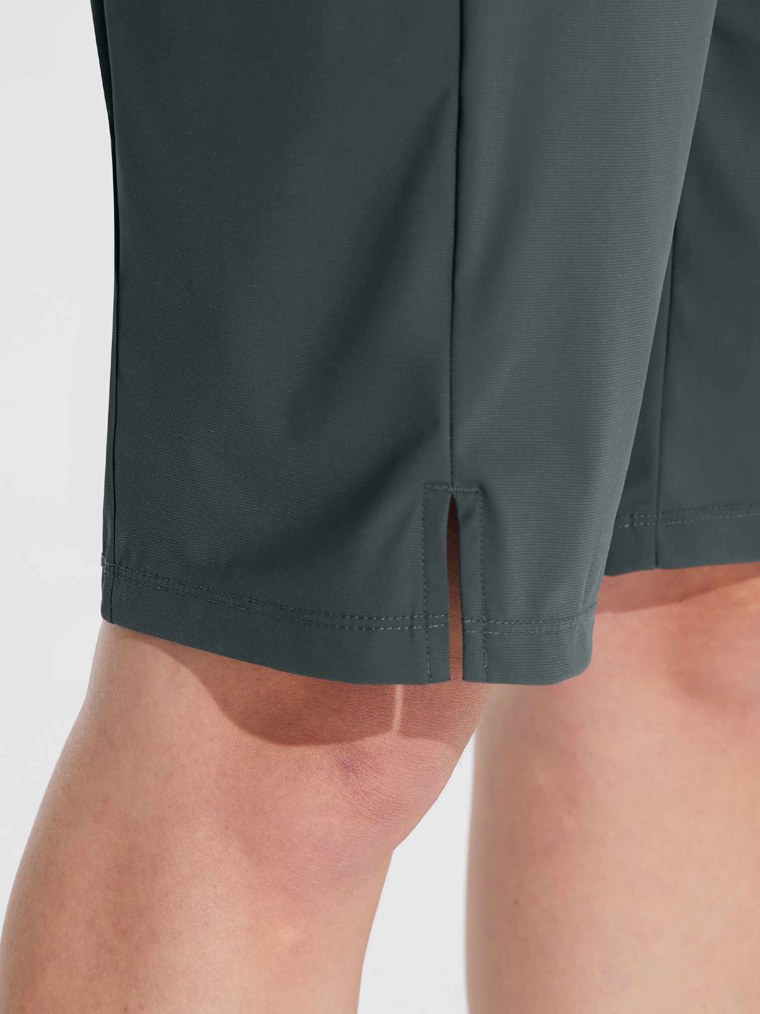 Women's dark gray 11" quick-dry hiking cargo shorts with side slit hem detail. #color_Dark Gray