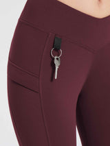 Maroon fleece-lined hiking leggings with side pocket and key loop. #color_Wine Red