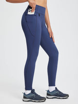 Navy blue thickened thermal leggings with high waist and phone pocket.