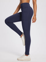 Dark navy 25" knit fleece pocket leggings with high rise and zippered thigh pocket. #color_Navy Blue