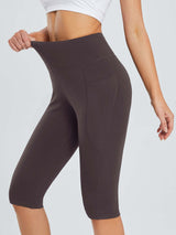 Women's plus size capris in dark purple with a high waistband and side pockets. #color_Dark Brown