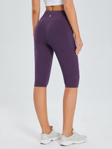 Women's plus size purple knee-length capris with pockets and a high waistband for yoga and running. #color_Dark Purple