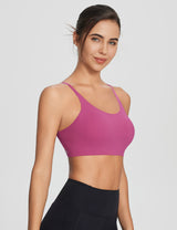 All-Day Active Essentials: Woman in pink Y-back seamless sports bra & black leggings. #color_Hot Pink