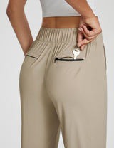 Adventure-ready active pants in tan, featuring a zippered key pocket. #color_Khaki