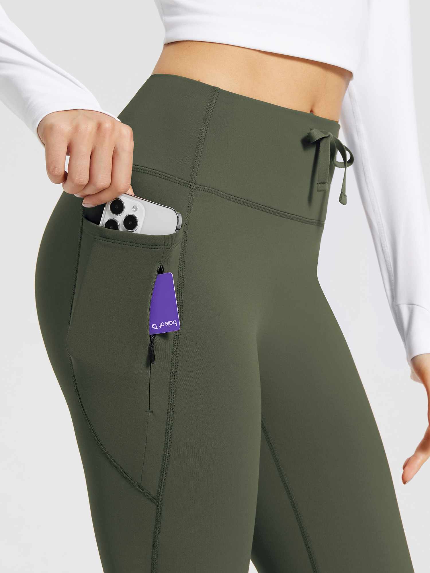Olive green high-waist fleece-lined flare pants with side pockets and drawstring. #color_Army Green