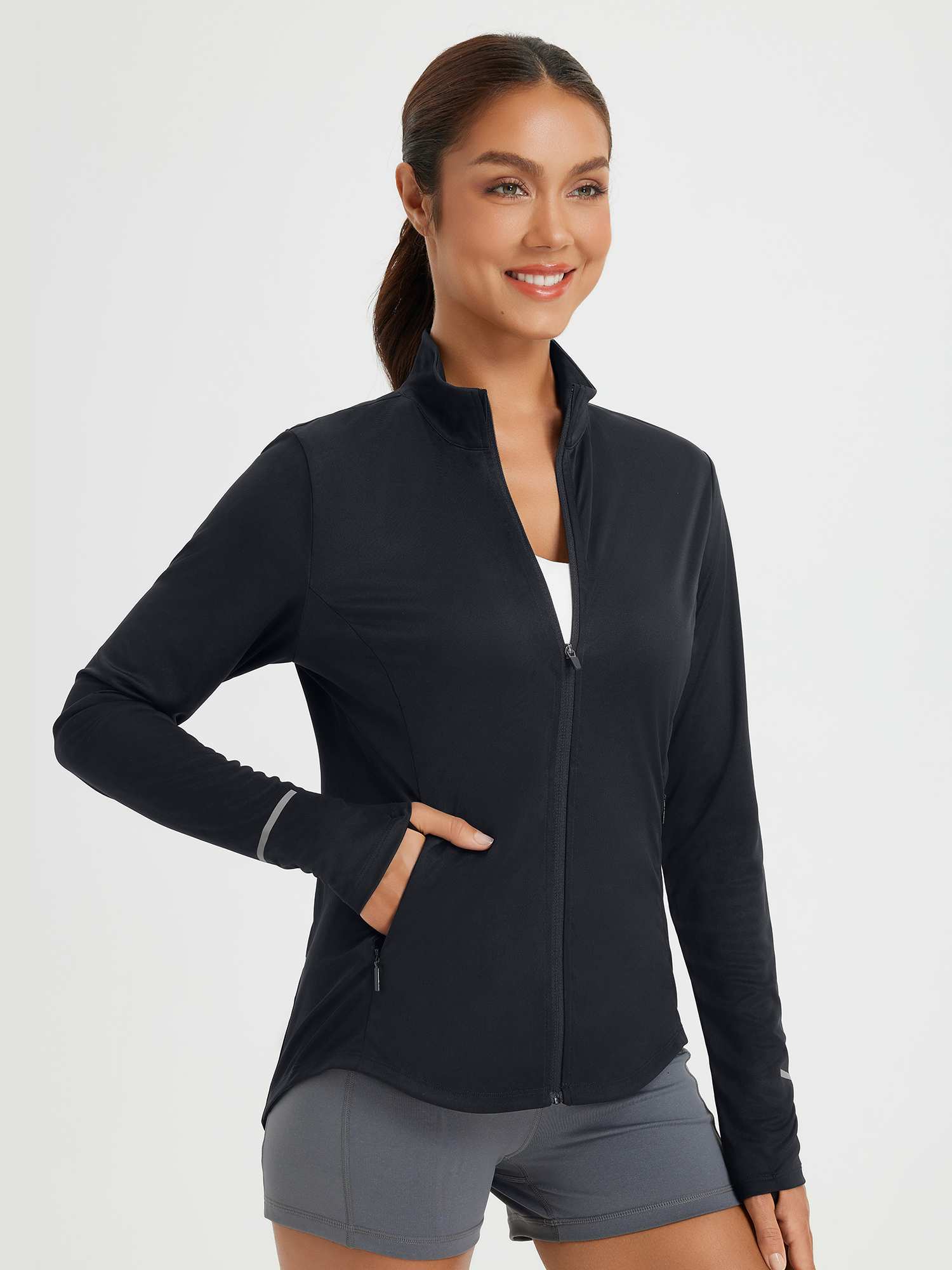 Women's black UPF 50+ full zip jacket, breathable, with thumbholes & reflective trim. #color_Black