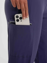 Women's 17 inch navy capris, zippered pocket holding smartphone for hiking and cycling. #color_Navy Blue