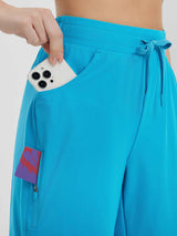 Women's 9" blue cycling shorts with phone in side pocket and card in zip thigh pocket.