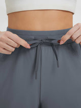 Grey women's 9" cycling shorts with adjustable drawstring waist. #color_Dark Gray