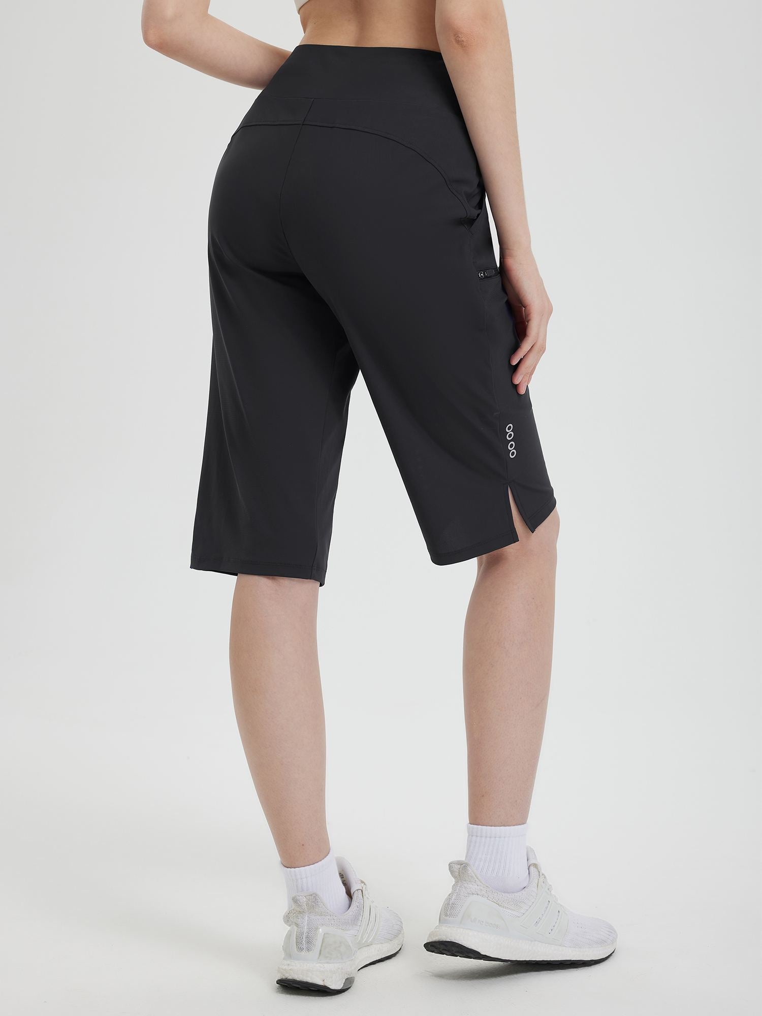 Black 14-inch casual cycling capris for women, knee-length with side slits and thigh pocket. #color_Black