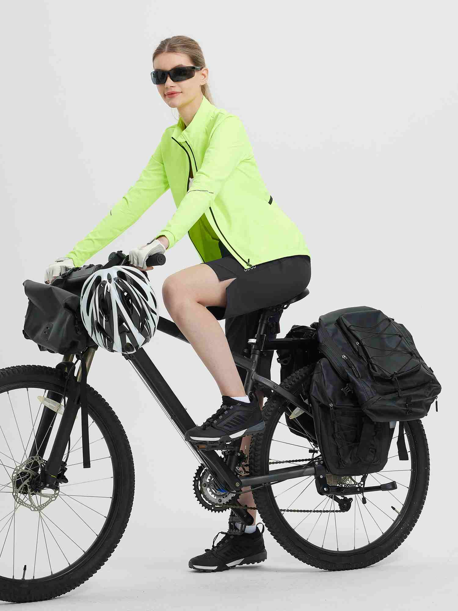 Casual black 14" cycling capris on woman with touring bike