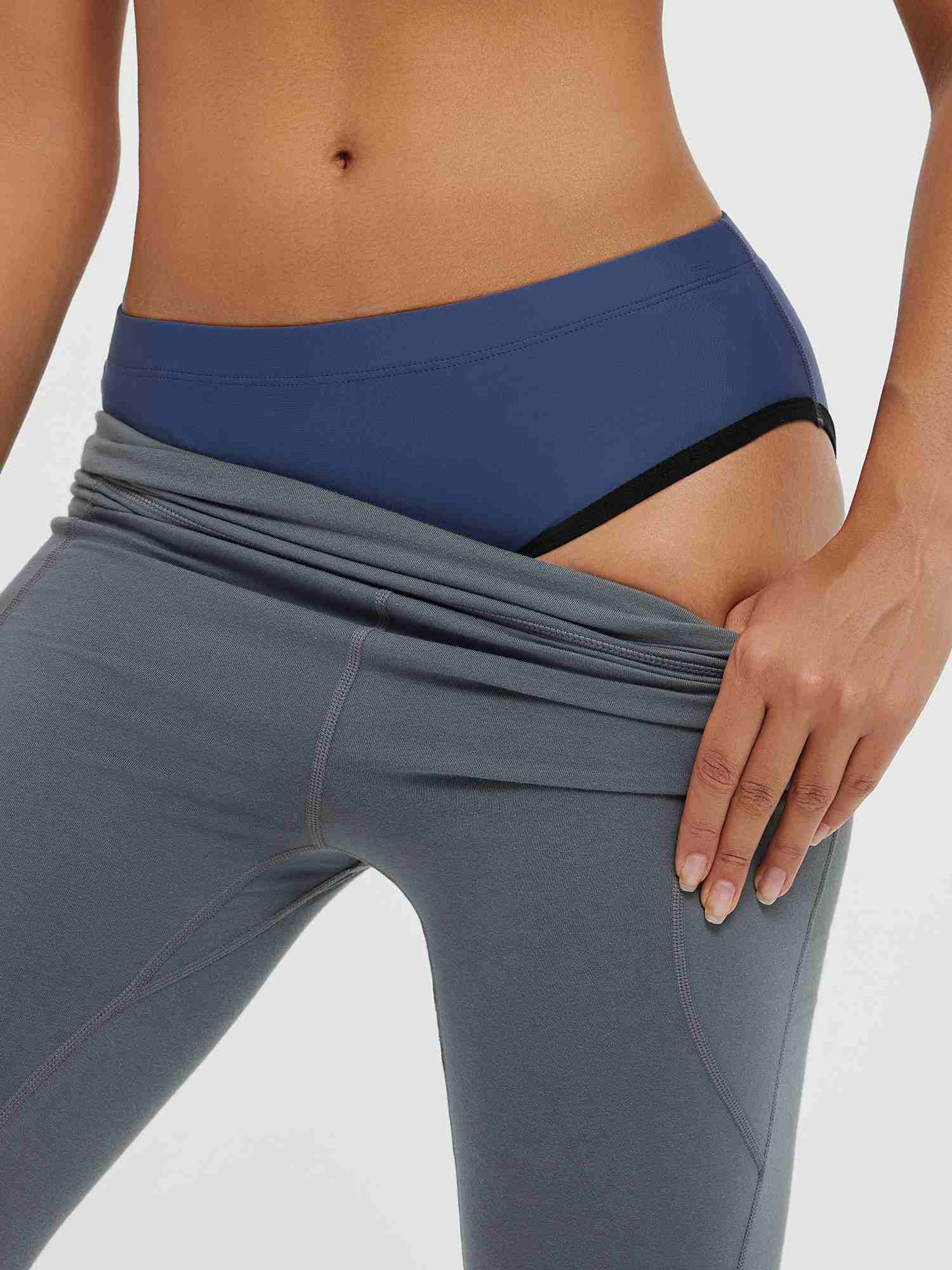 Grey cycling shorts showing blue padded bike underwear waistband. #color_Navy Blue