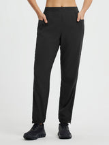 Black cycling elastic tapered pants with elastic waist and ankle zippers. #color_Black