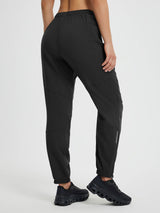 Black polyester cycling pants: tapered leg, elastic waist, ankle zips, reflective. #color_Black