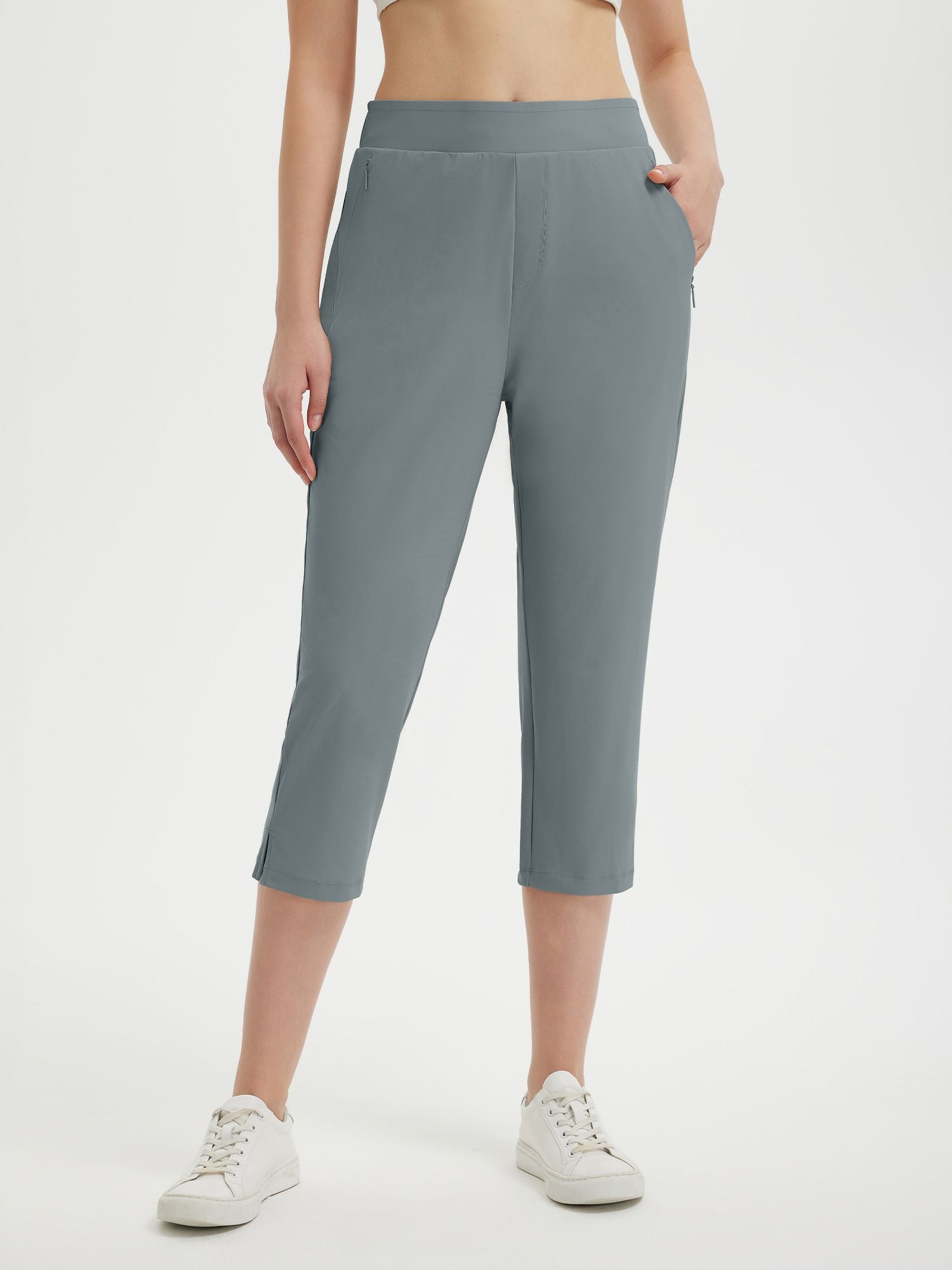 Women's grey high-waisted 20" cropped golf pants with zip pockets and split hem. #color_Dark Gray