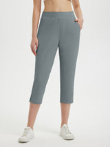 Women's grey high-waisted 20" cropped golf pants with zip pockets and split hem. #color_Dark Gray