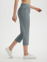 Grey women's 20" high-waisted cropped golf pants featuring zip pocket and split hem. #color_Dark Gray