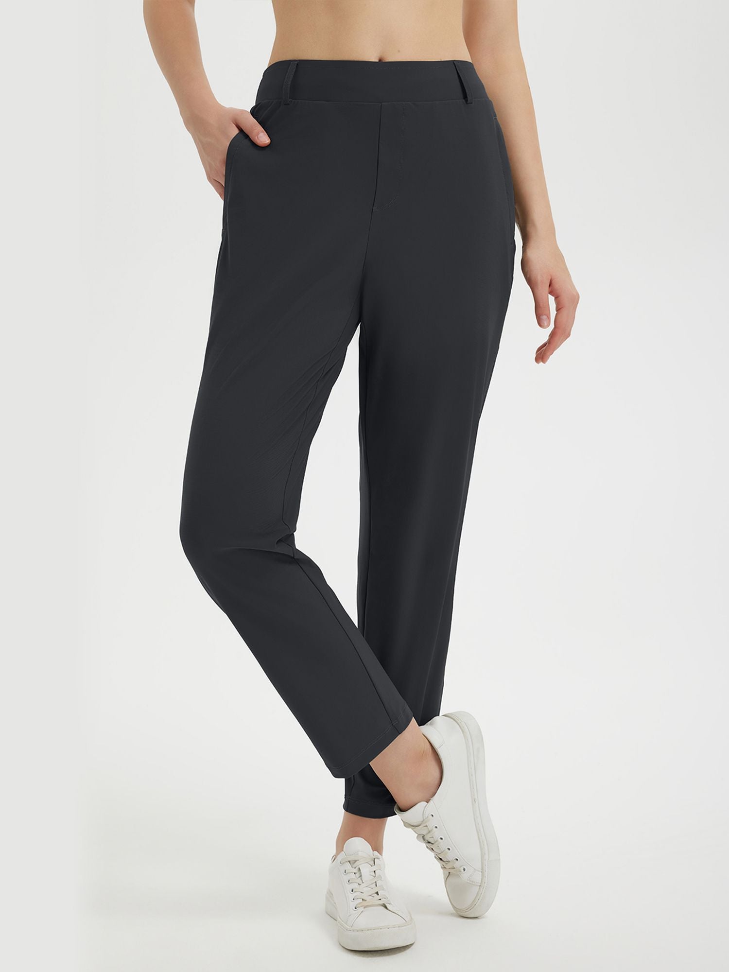 Black lightweight, stretchy women's 27-inch golf pants with a comfortable elastic waistband. #color_Black