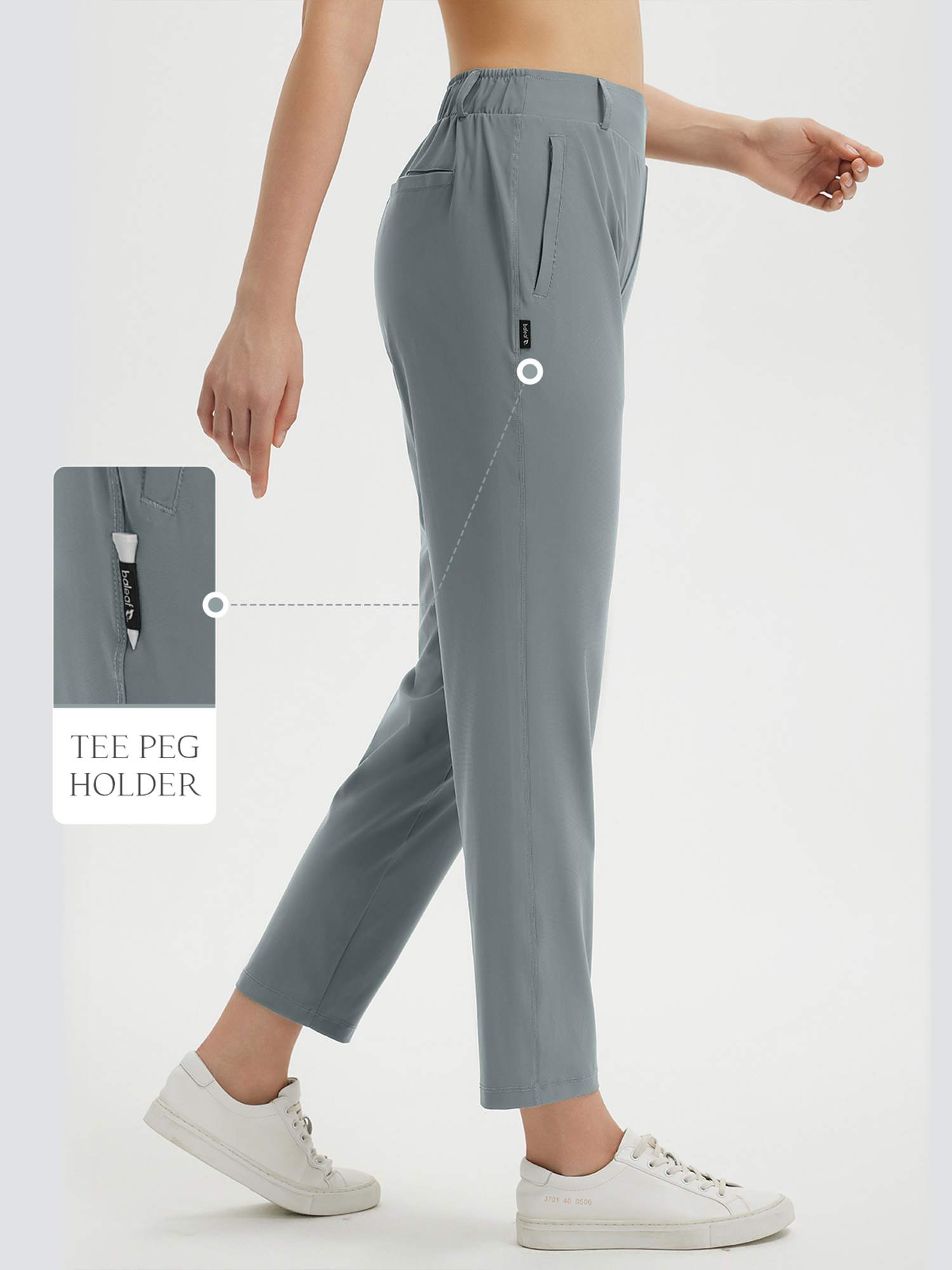 Women's grey 27" golf pants with visible tee peg holder feature. #color_Dark Gray