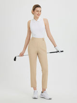 Women's khaki 27-inch golf pants with white polo and golf club #color_Khaki