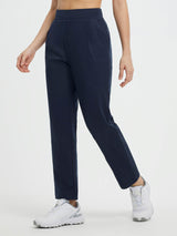 Navy pleated fleece slim-fit golf pants with drawstring waistband and front pleat. #color_Navy Blue