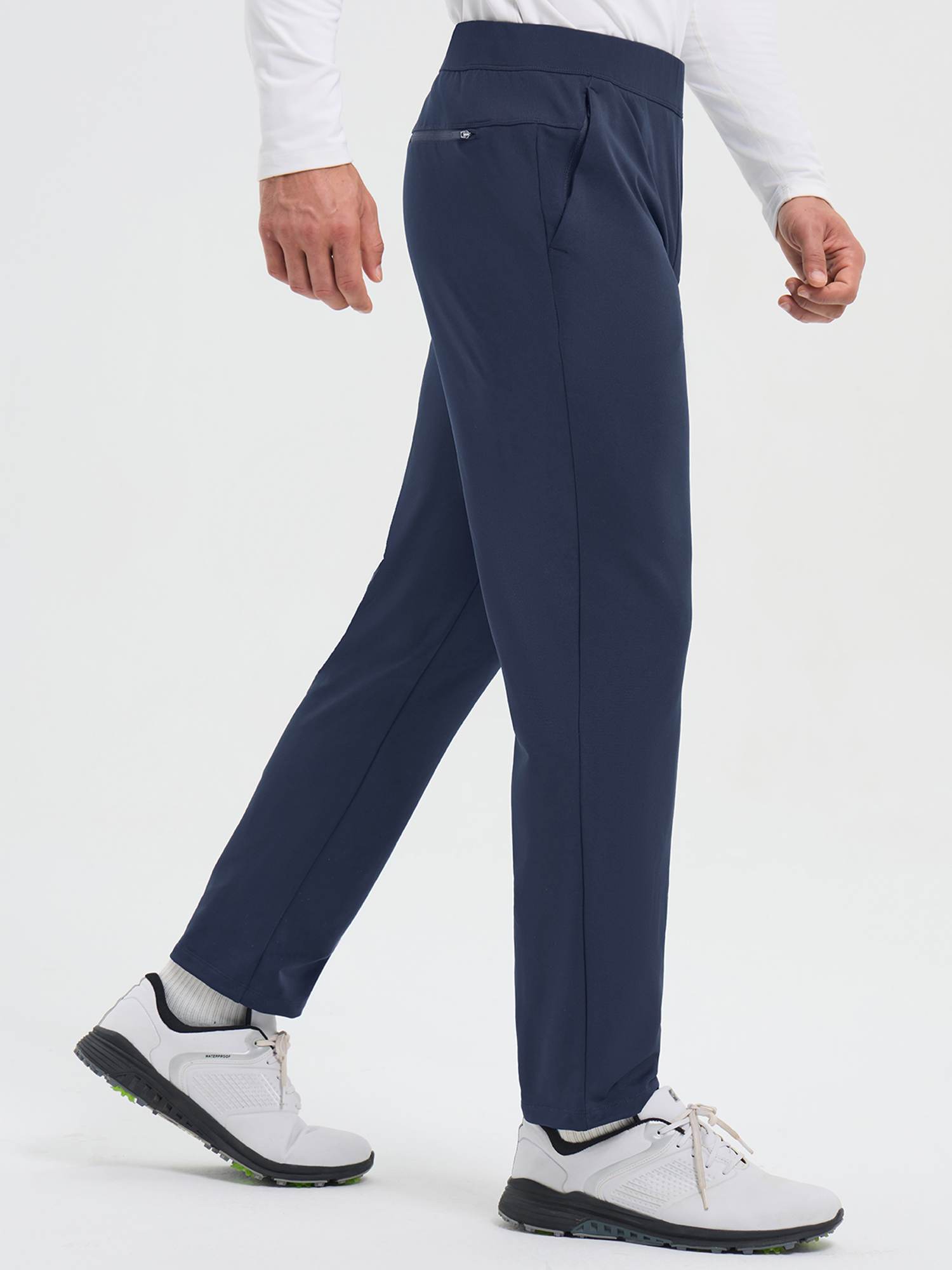 Men's navy fleece golf pants with elastic waist and straight legs. #color_Navy Blue