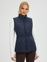 Women's navy quilted golf vest with cinched drawstring waist. #color_Navy Blue
