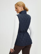 Women's navy quilted golf vest with adjustable drawstring waist. #color_Navy Blue