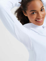 White ski fleece base layer with protective hood, raglan sleeves and textured detail.