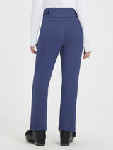 Back view of blue heavyweight knit fleece straight ski pants with articulated knees and ski boots. #color_Navy Blue
