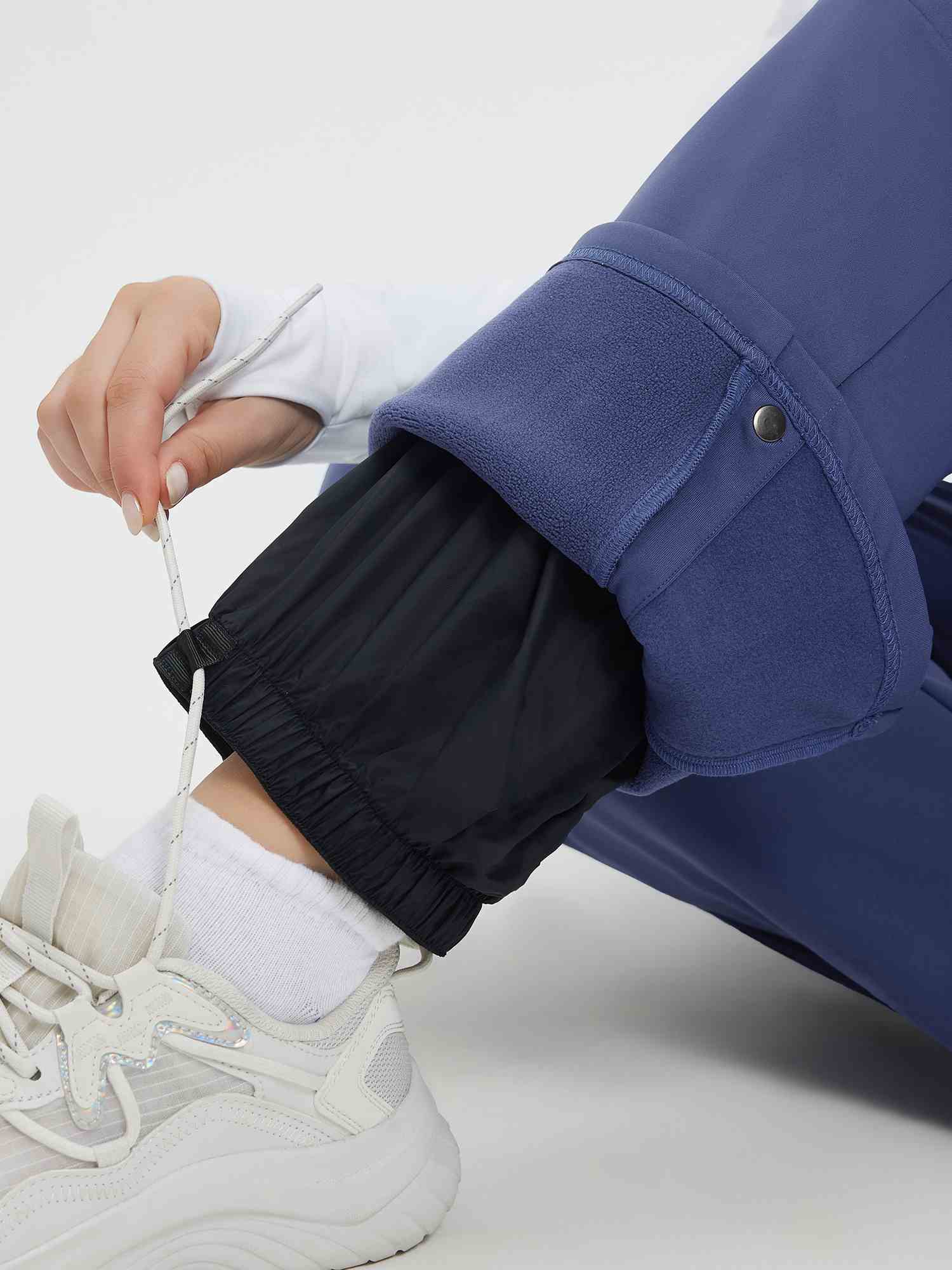 Knit heavyweight fleece ski pants adjustable cuff with drawstring detail. #color_Navy Blue