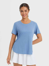 Blue women's outdoor short sleeve crew neck t-shirt with white skirt. Lightweight, breathable, UPF 50+ sun protection.