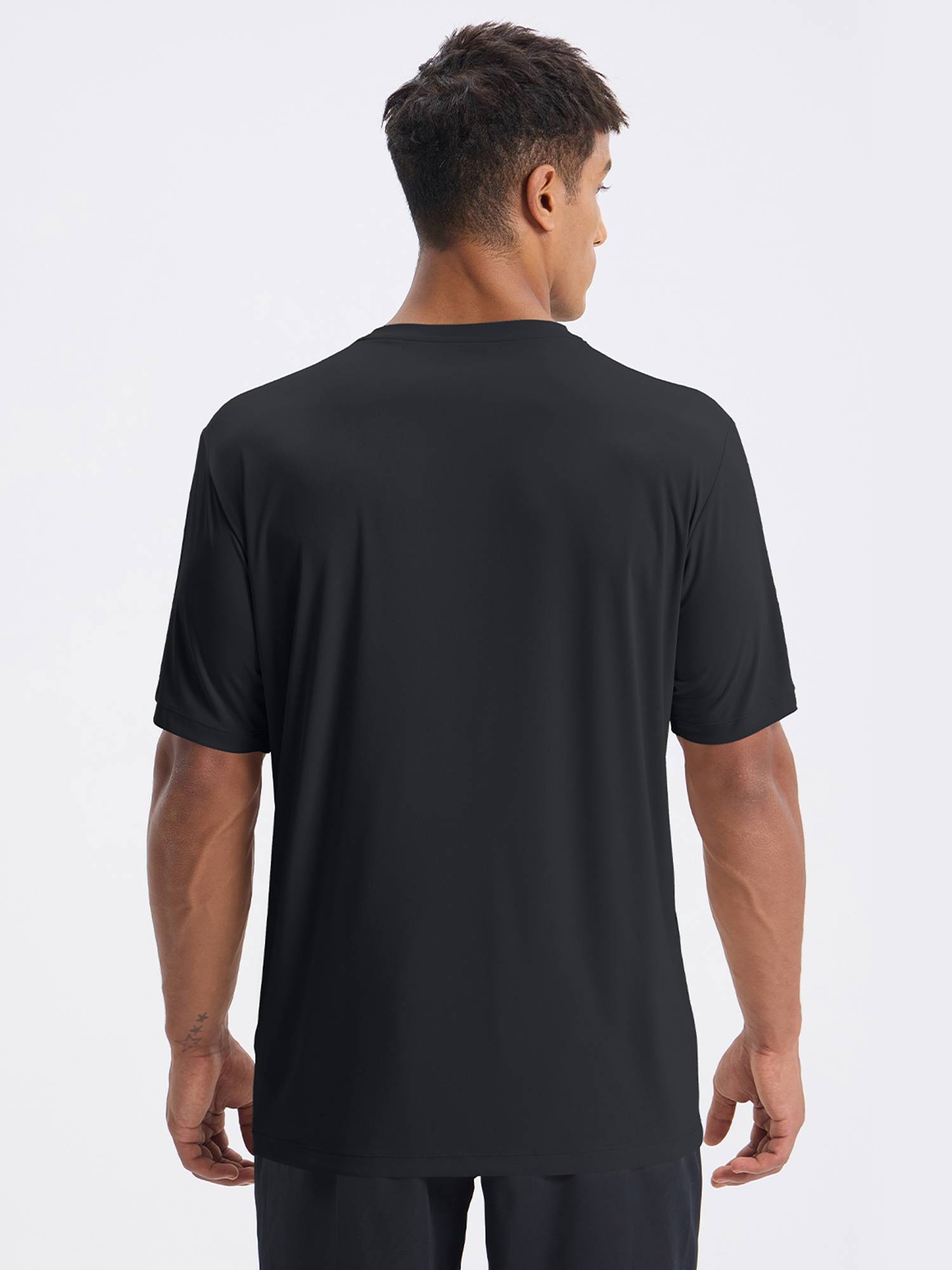 Man wearing black short sleeve crew neck t-shirt, back view. UPF 50+, quick-dry features. #color_Black