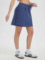 Women's blue UPF 50+ hiking cargo skort with drawstring waist and 16" inseam. #color_Navy Blue
