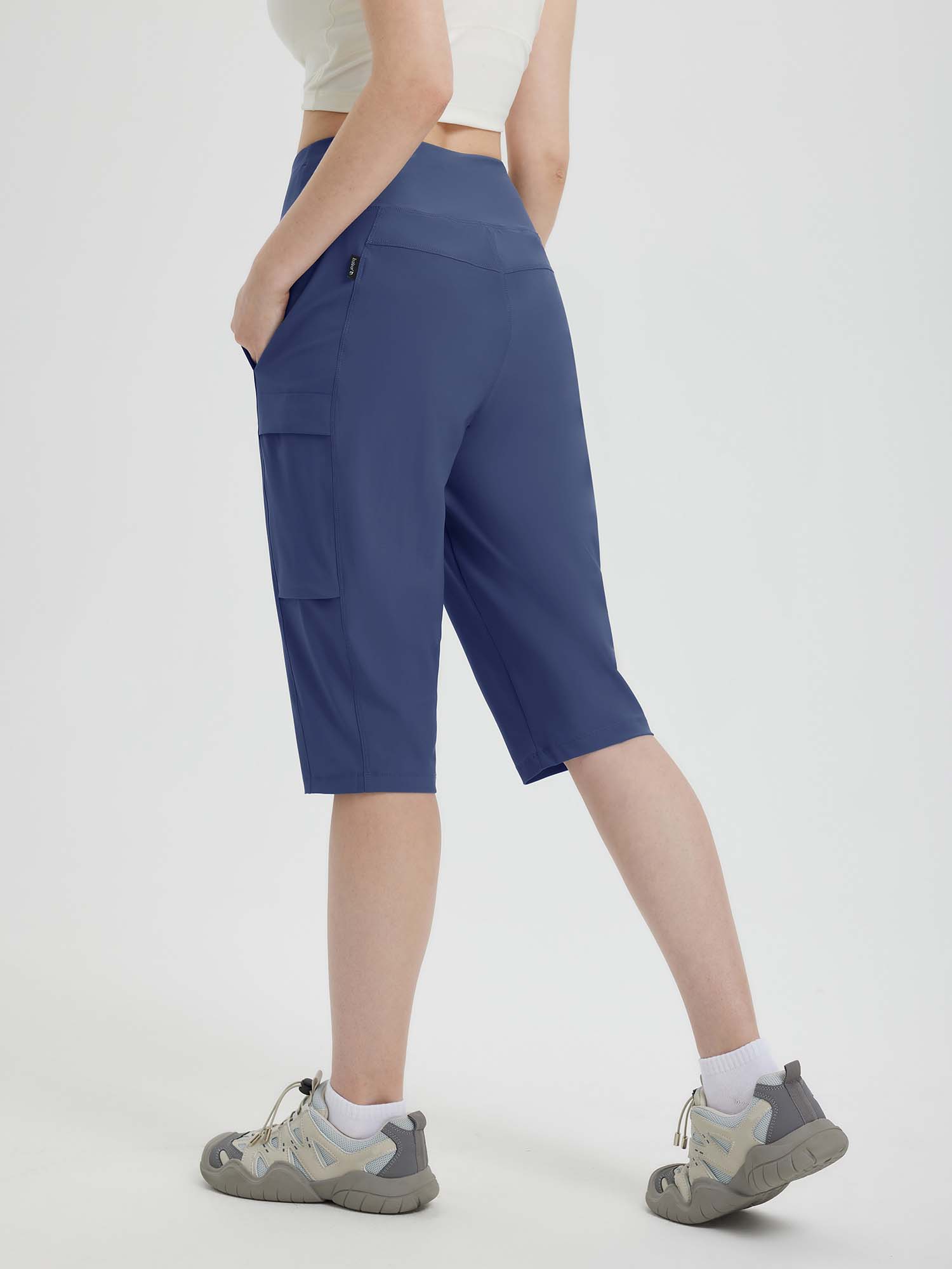 Navy blue women's 15" hiking shorts with cargo pockets, high waistband, and below-the-knee length. #color_Navy Blue