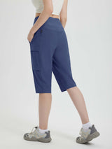 Navy blue women's 15" hiking shorts with cargo pockets, high waistband, and below-the-knee length. #color_Navy Blue