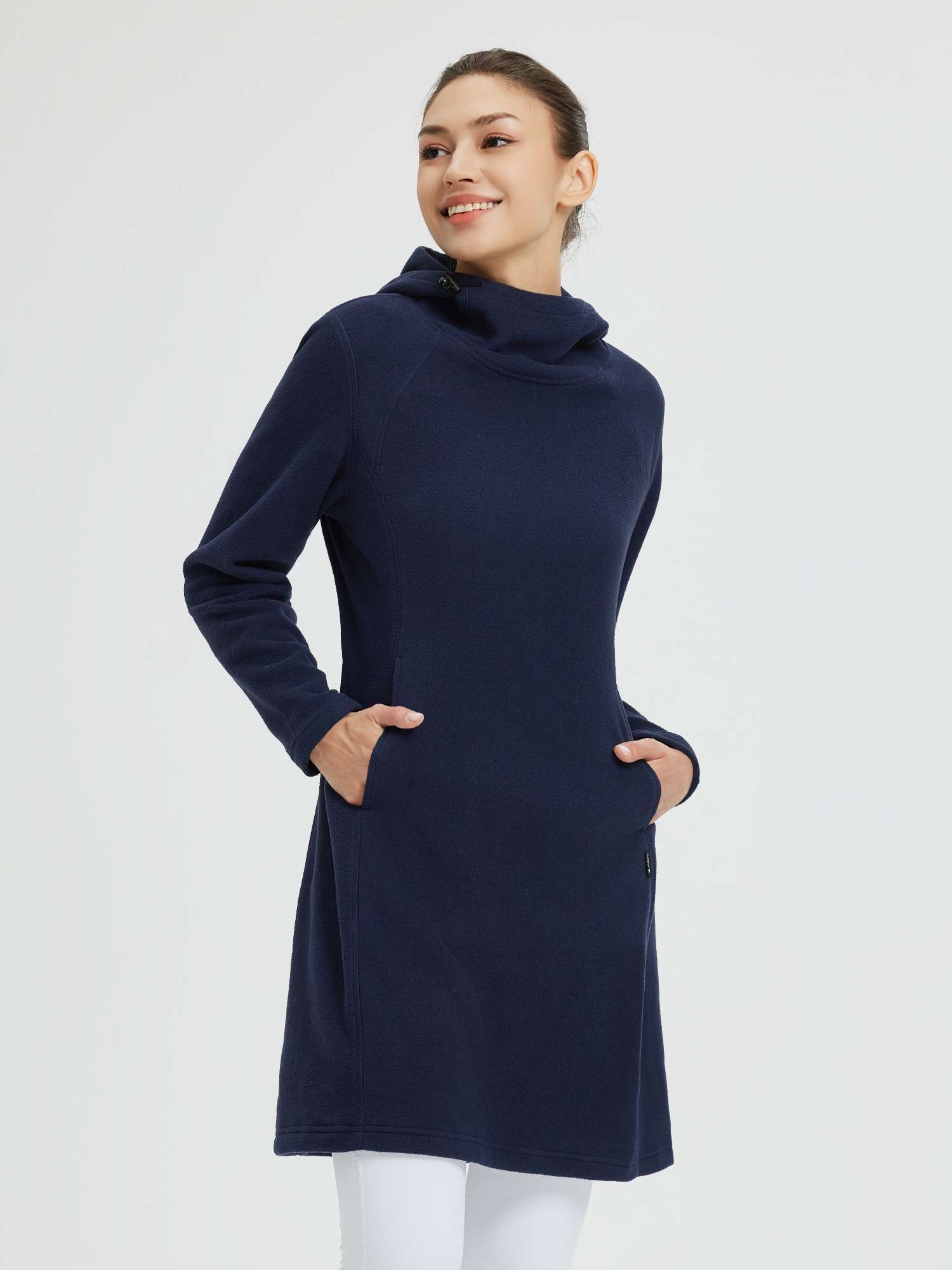 Woman in navy blue hooded polar fleece dress with drawstring hood and kangaroo pocket. #color_Navy Blue