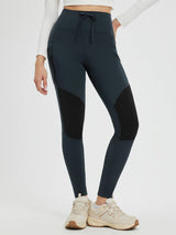 Outdoor slim-fit knit fleece pants in dark teal with zipper pockets and panel details