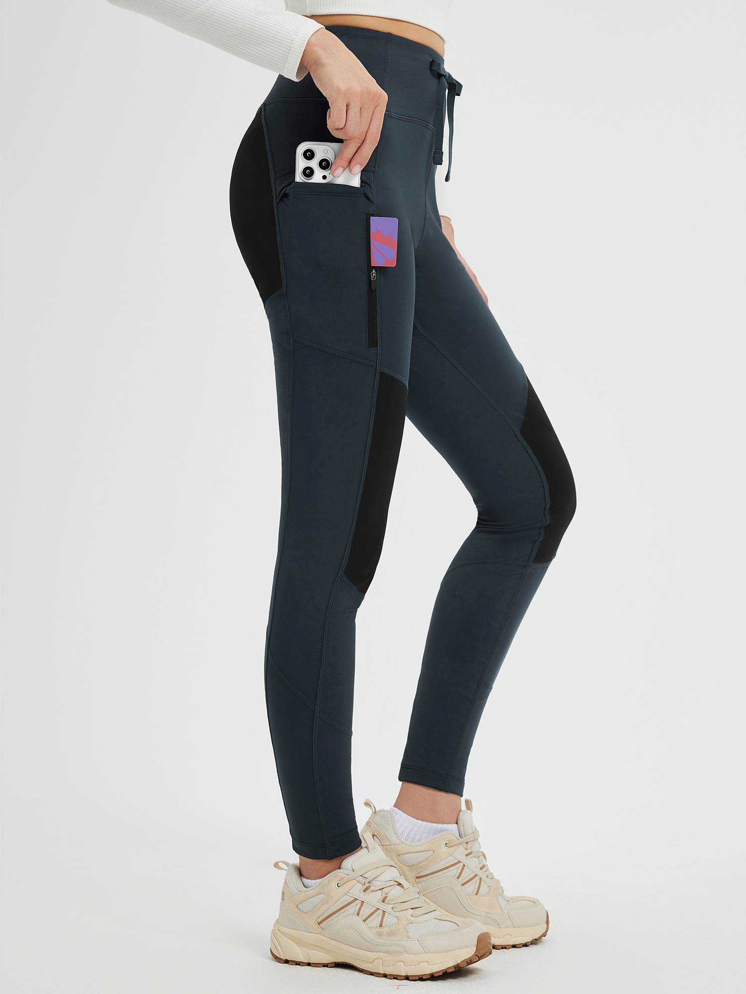 Outdoor slim-fit knit fleece pants with accent seams, multiple pockets, zipper, and drawstring. #color_Dark Gray/Black