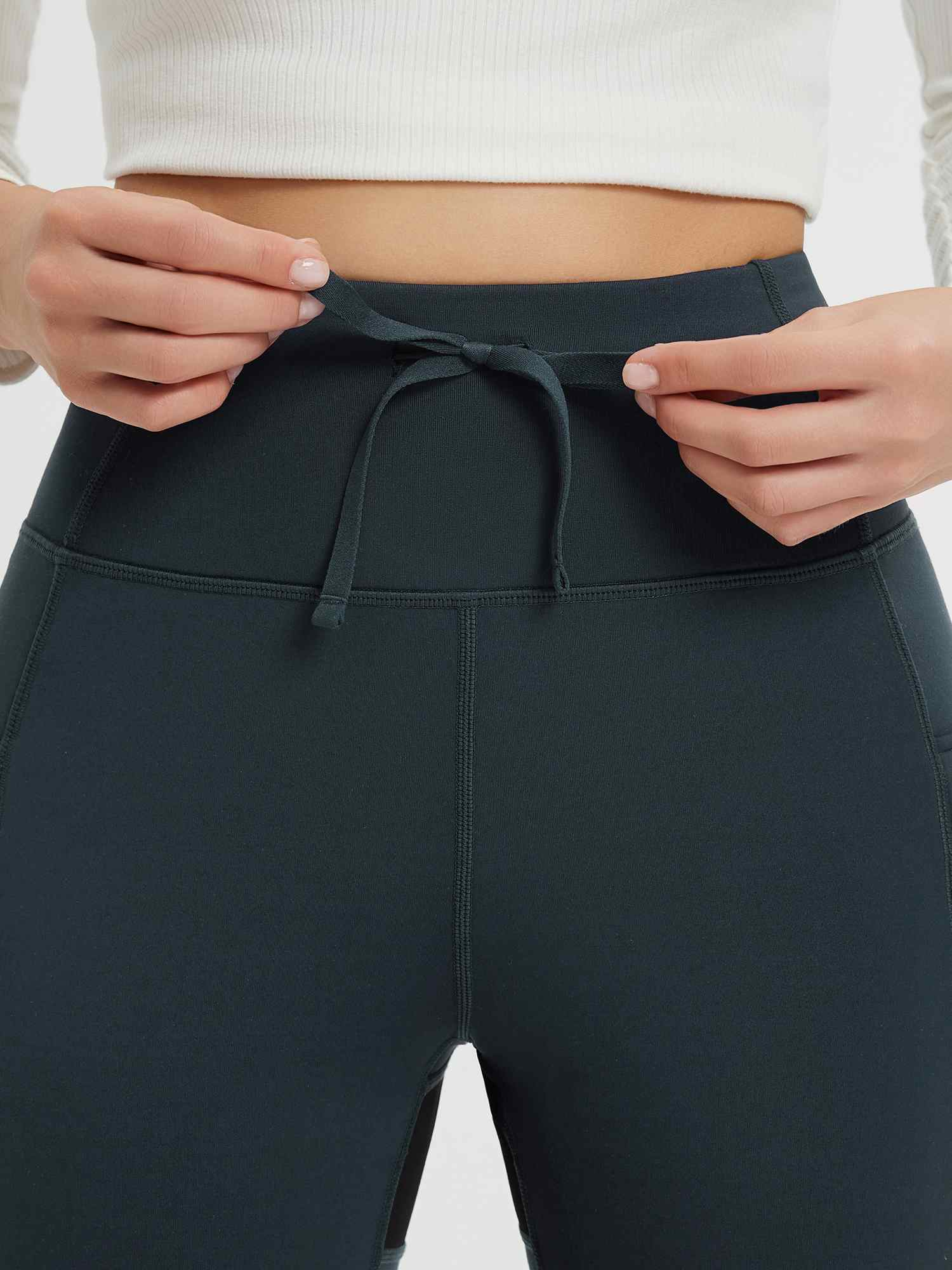 Dark grey knit fleece pants: high waist drawstring detail. #color_Dark Gray/Black