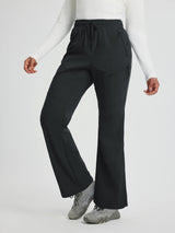 Women's black softshell straight-leg outdoor pants with 3 zipper pockets. #color_Black