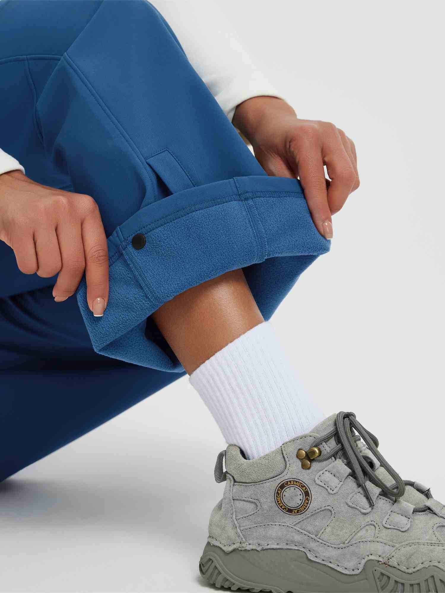 Women's blue softshell pants with thermal fleece lining shown. #color_Cobalt Blue