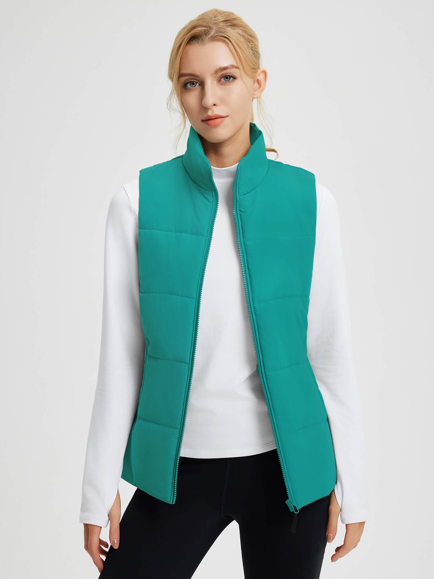 Outdoor teal quilted Dupont insulated vest with stand-up collar. #color_Green