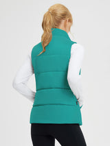Teal Dupont insulated quilted vest on woman, back view for outdoor use. #color_Green