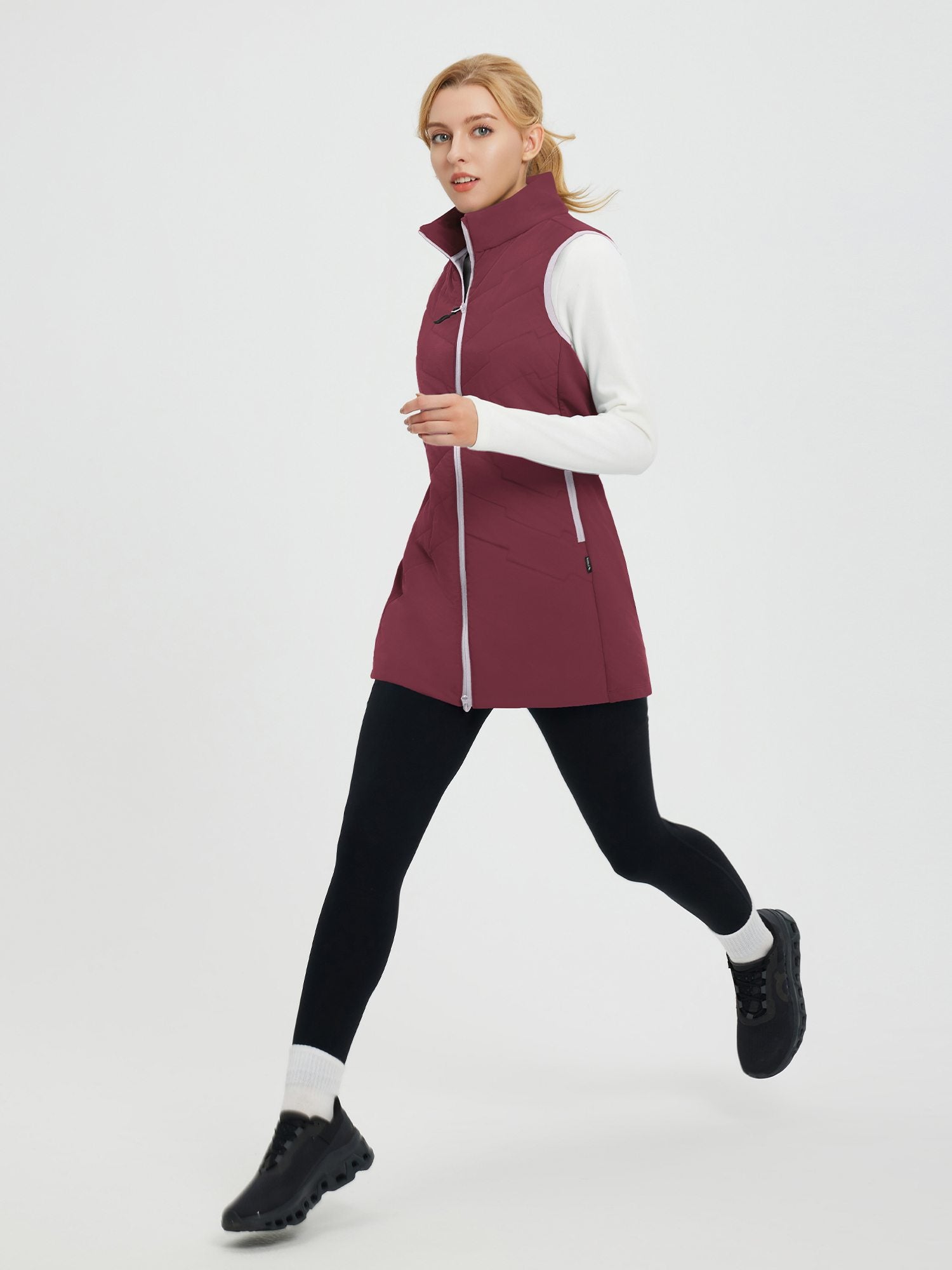 Women's maroon mid-length puffer hiking vest with zipper and quilted stitching. #color_Wine Red