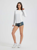 Women's white long sleeve running shirt, breathable and quick-drying fabric, shown on model. #color_White
