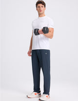 Men's dark blue stretch waist tapered joggers for athletic activities. #color_Navy Blue