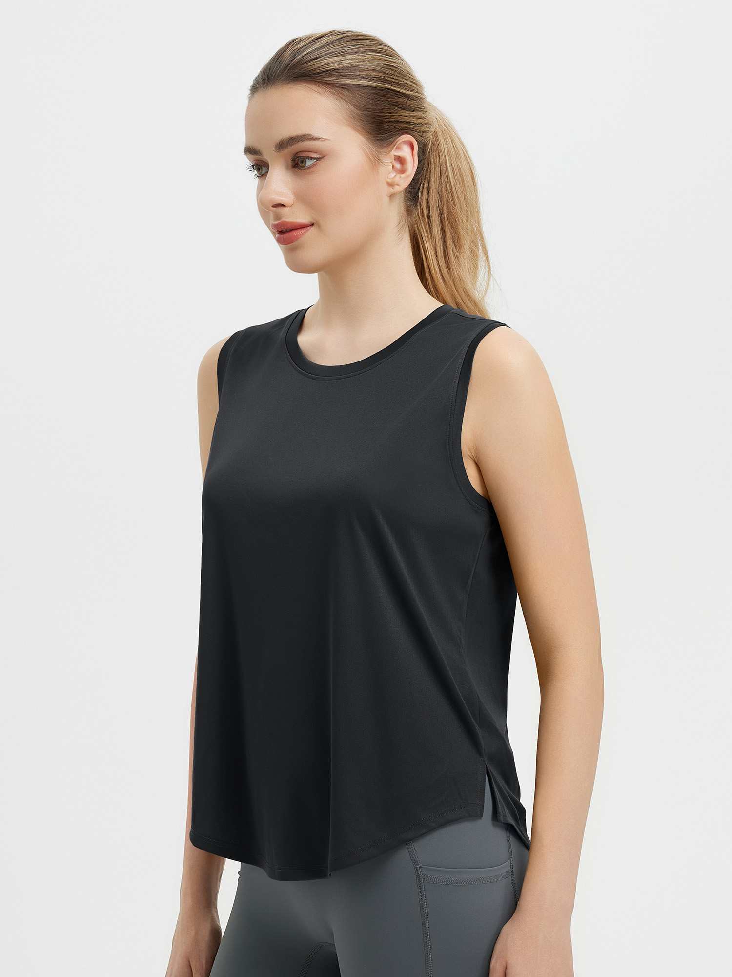 Black women's sleeveless racerback running tank top with scoop neck and side slits. #color_Black