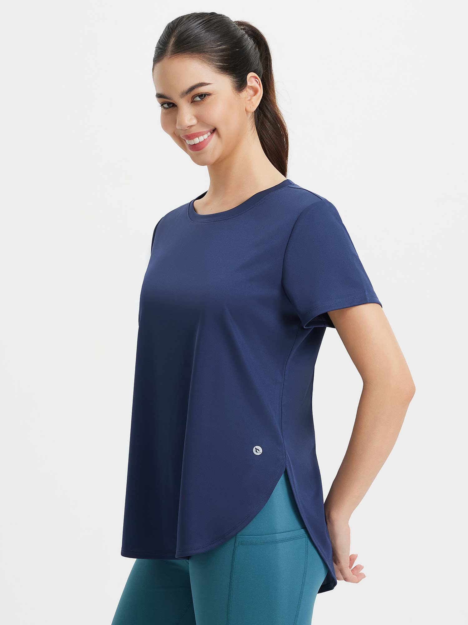 All-Day Active Set: Woman in navy blue UPF 50+ crew neck active shirt & teal leggings. #color_Navy