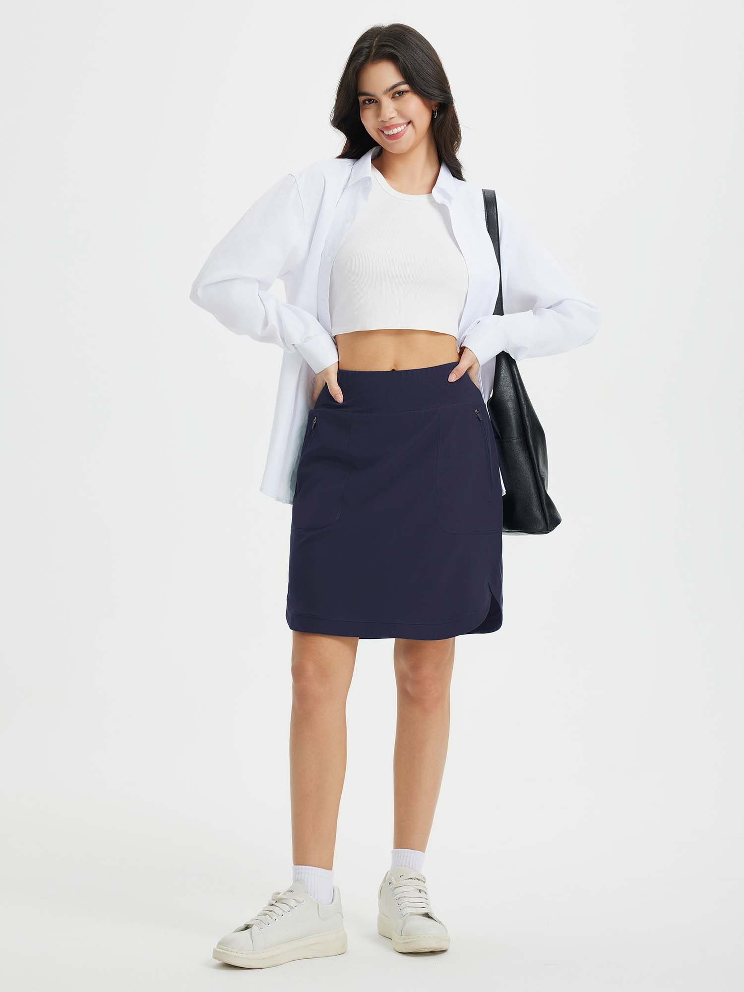 Navy blue women's quick-dry running skort, UPF 50+, with secure zipper pockets and side slits. #color_Navy Blue